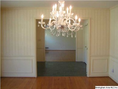 Large dining room with hardwood flooring.