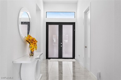 Entryway with french doors and baseboards