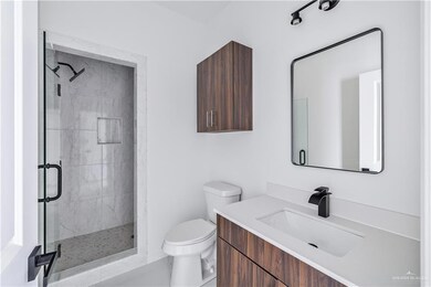 Full bath with vanity and a stall shower