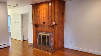 Unfurnished living room featuring fireplace