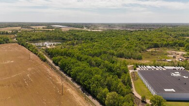 Aerial view featuring a water view and a view of t