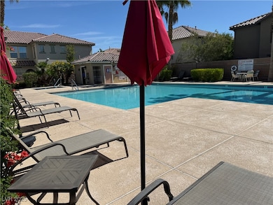 Community pool featuring a patio
