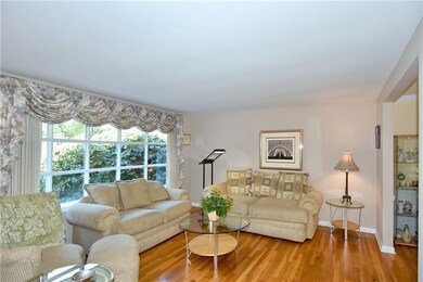 The light bright living room boasts a large window