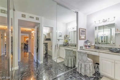 Full bathroom with marble tiled flooring, toilet,