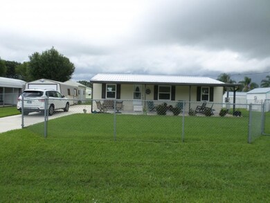 FRONT WITH CHAINLINK FENCE