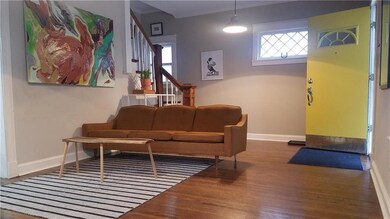 Living room full of light. Diamond pane windows in