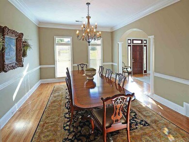 The formal dining room immediately greets you into