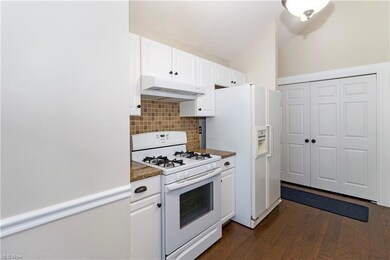 laundry and garage entrance at far wall of this ph