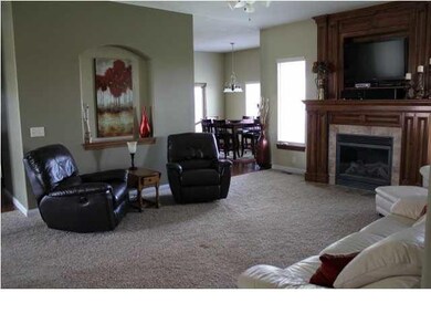 Living room is spacious with many windows for lots