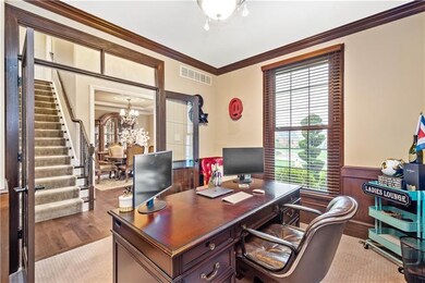 The study lies behind French doors and transom, wi