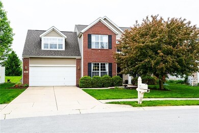 Stunning curb appeal with dormer window, brick accents and lovely landscaping!