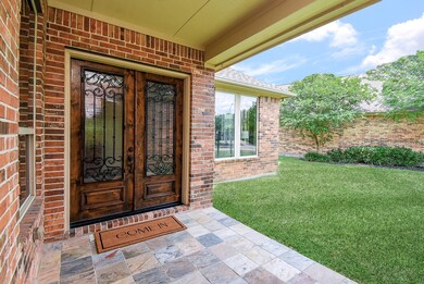 Ornate wrought iron details on solid wood double d