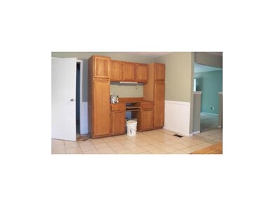 BUILT IN CABINETS IN THE DINING ROOM    TILE FLOOR