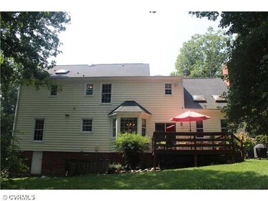 Exterior Back - A relaxing deck, newer roof, skyli