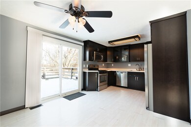 Sliding glass doors to the deck and backyard