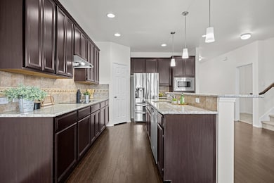 Kitchen featuring appliances with stainless steel
