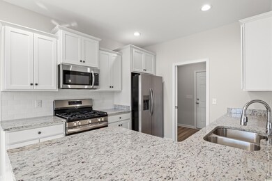 Kitchen featuring hardwood / wood-style floors, wh