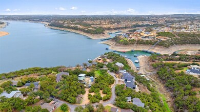 View of property location with a nearby body of water and nearby suburban area