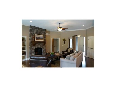 Gleaming hardwoods in the open Great Room.