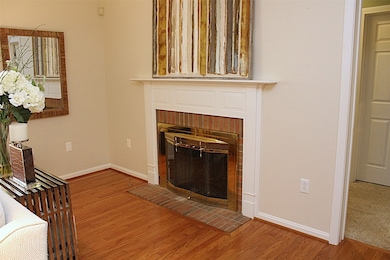 Living room features a fireplace.