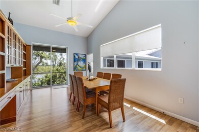 Left living area dining with slider doors to rear