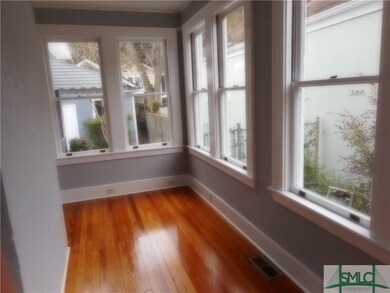 Just off the living is a sunroom that will make a 