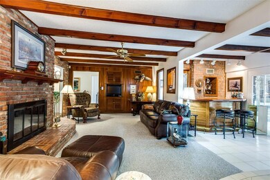 Woodburning fireplace with gas starter and wet bar