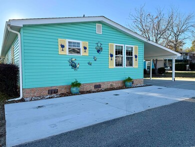 View of home's exterior featuring a carport
