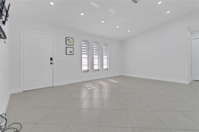 Spare room featuring light tile patterned floors