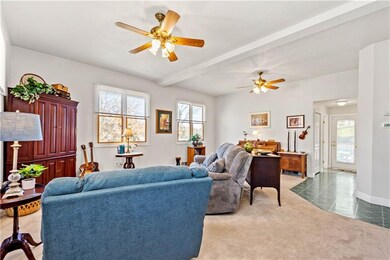 DOWN THE HALL IS THE LAUNDRY RM W/CABINTREY & UTILITY SINK, HALF BATH, COAT CLOSET AND STORAGE CLOSET.  GLASS DOOR LEADS OUT TO PATIO.2 CLOSETS