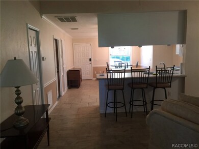 Front door and kitchen from living room