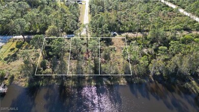 Aerial view featuring a water view. Boundary lines