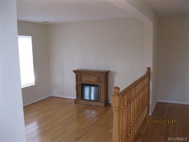 Living & dining rooms with hardwood floors plus el