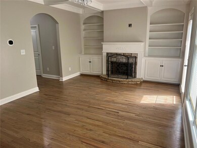 Unfurnished living room with crown molding, a fire