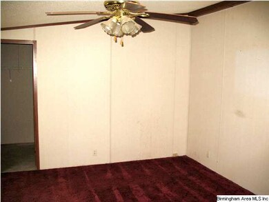 The Master Bedroom is spacious and has its own bat