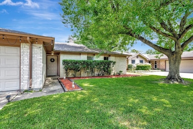 Mature shade tree with well-manicured lawn