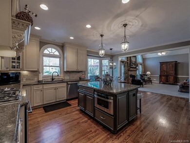 Kitchen view of island with space saving microwave
