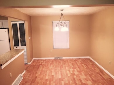 The dining room is formal yet open to the kitchen 