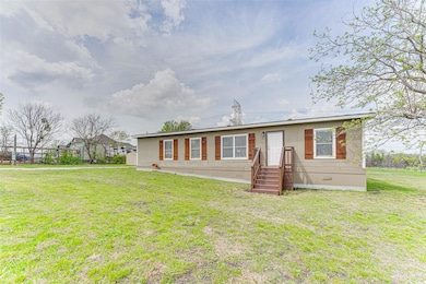 View of front of property with a front lawn