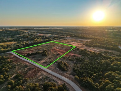 Aerial view at dusk of property parcel outlined and a rural view