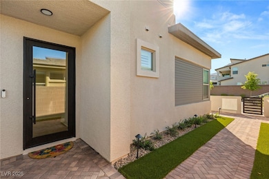 Entrance to property featuring stucco siding and f