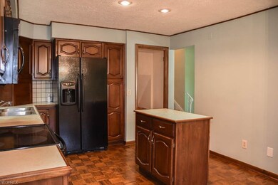 The kitchen has a center island and a pantry.