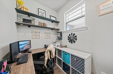 Home office featuring wood finished floors and a 
