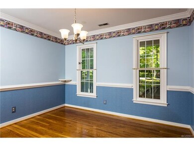 Formal dining room- hardwood floors, chair rail, c