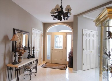 Tiled entry way with two double closets