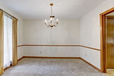 The formal dining room features a terrazzo tiled f