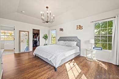 Retreat to a serene primary suite with a large wal