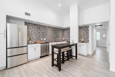 Kitchen featuring appliances with stainless steel