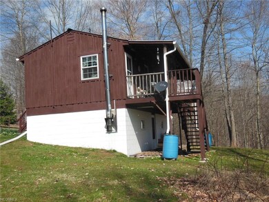 Rear deck off the kitchen with steps outside as we