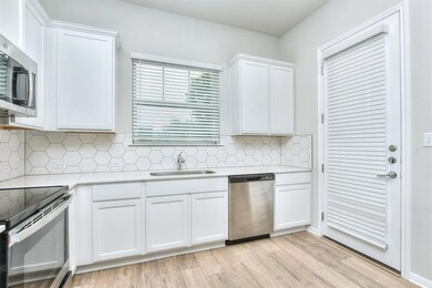 Kitchen featuring appliances with stainless steel